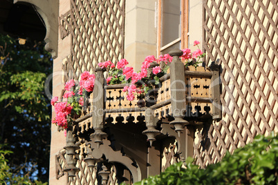 Wood balcony with beautiful pink flowers
