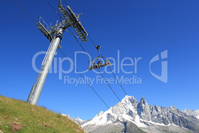 Bikers on a chairlift in the mountain