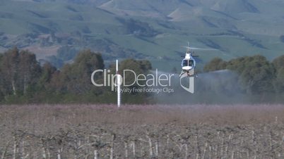 helicopter spraying trees