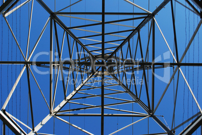 Looking up at power transmission tower