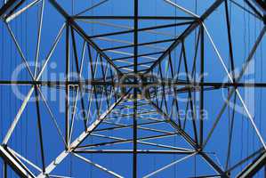 Looking up at power transmission tower