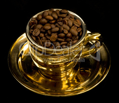Gold cup with coffee beans