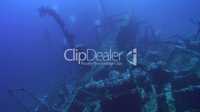 Technical diver exploring deep shipwreck