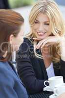 Two Beautiful Young Women Having Coffee