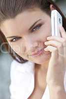 Beautiful Young Woman With Green Eyes On Cell Phone