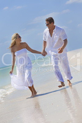 Happy Young Couple Running Holding Hands on A Tropical Beach