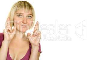 Young woman with fingers crossed