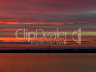 Dramatic colors and sky in sunset over the limfjord, Denmark we