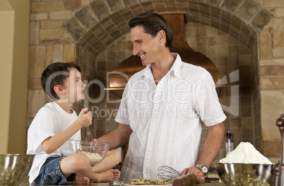 Father and Son In Kitchen Cooking Baking Cookies