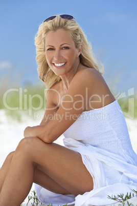 Beautiful Blond Woman in White Dress At Beach