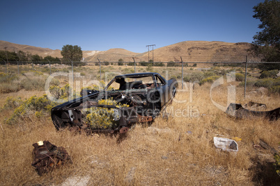 Old rusty abandoned car