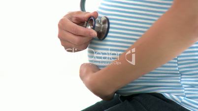 Schwangere mit Stethoskop