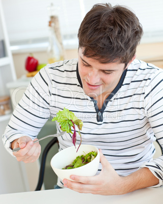 man eating a salad