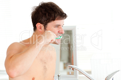 man brushing his teeth