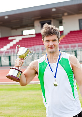 male athlete holding a cup