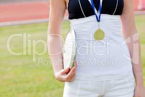 female athlete with a gold medal
