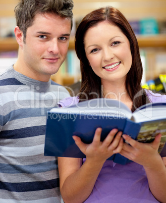 students reading a book