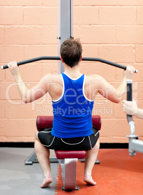 male athlete practicing body-building