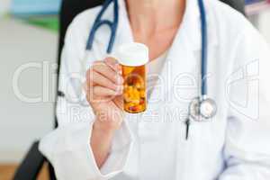 female doctor holding pills