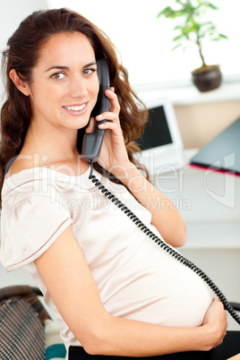 pregnant businesswoman talking on phone