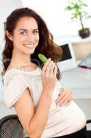 pregnant woman eating a gherkin