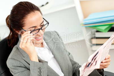 businesswoman reading a newspaper