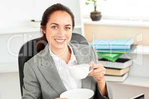 Businesswoman holding a cup of coffee