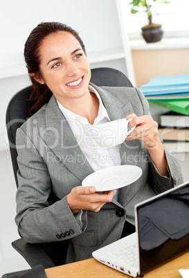 Businesswoman holding a cup of coffee