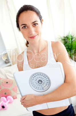 beautiful woman holding a scale