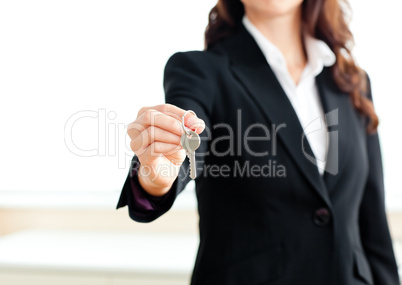 businesswoman holding a key