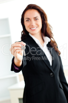 businesswoman holding a key