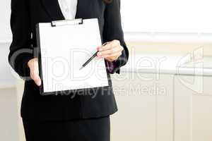 businesswoman holding a clipboard