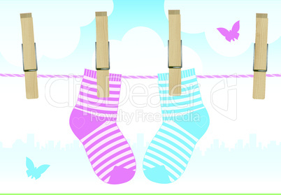Vector illustration of a line with clothespins and baby socks.