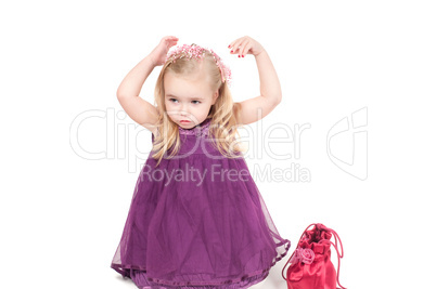 Studio shot of baby girl in gala dress