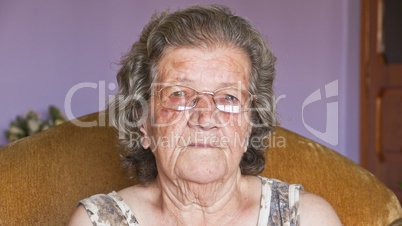 Portrait of senior woman smiling in home