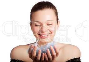 Beautiful girl with feathers in hands