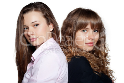 Portrait of two beautiful women on white