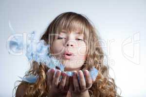 Beautiful girl with feathers in hands