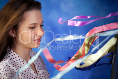 Young woman posing on a blue background