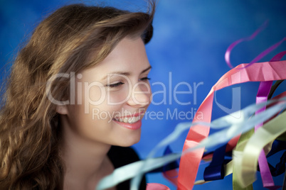 Young woman posing on a blue background