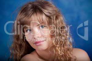 Young woman posing on a blue background