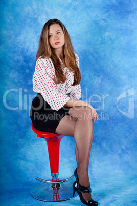 Girl sitting on chair and posing