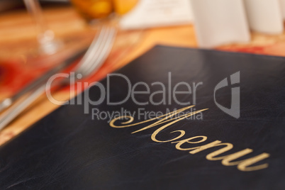 Menu & Cutlery on A Restaurant Table