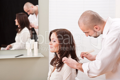 Professional hairdresser comb customer at salon