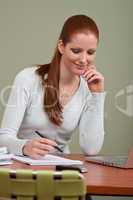 Long red hair business woman at office