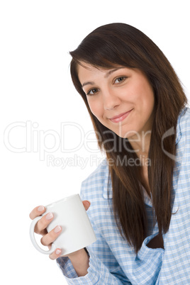 Happy young woman with coffee in pajamas