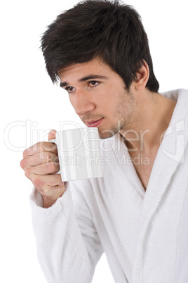 Morning - Young man in bathrobe with cup of coffee