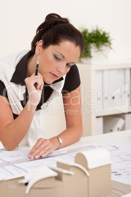 Female architect working at the office
