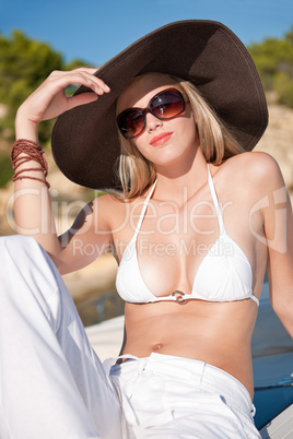 Attractive blond woman relaxing on sunny day