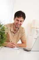 Successful modern businessman with laptop